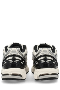 New Balance unisex sneaker 1906r silver black and white athletic shoes with mesh panels and rubber soles