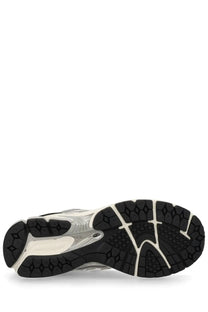 Black and white rubber sole with textured geometric tread pattern on new balance unisex sneaker 1906r silver