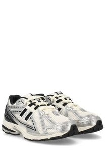 New balance unisex sneaker 1906r silver in white and silver with black accents designed for running and casual wear