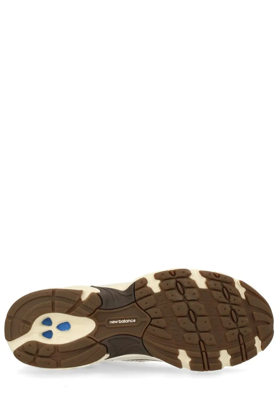 New balance unisex sneaker beige with brown and cream rubber sole featuring blue triangular accents and new balance logo