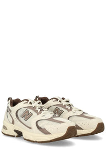 New Balance unisex sneaker beige with cream and brown mesh and synthetic overlays for comfortable wear