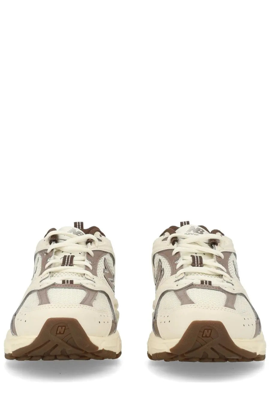 Cream and brown new balance 542 unisex sneaker with mesh and synthetic overlays in beige color