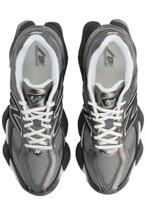 New balance 9060 sneaker with sleek metallic gray and black upper mesh panels white laces and bold rubber soles