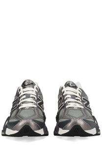 New Balance unisex sneaker black with silver and black mesh uppers white laces and chunky rubber sole