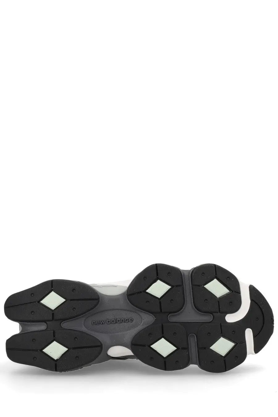 Black and white new balance unisex sneaker sole with chunky multi-layered design and diamond-shaped rubber grips