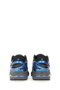 New Balance unisex sneaker blue in blue and black with metallic accents featuring durable materials for everyday wear
