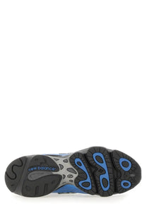 New Balance unisex sneaker sole in blue and black with a distinctive wave-like tread pattern