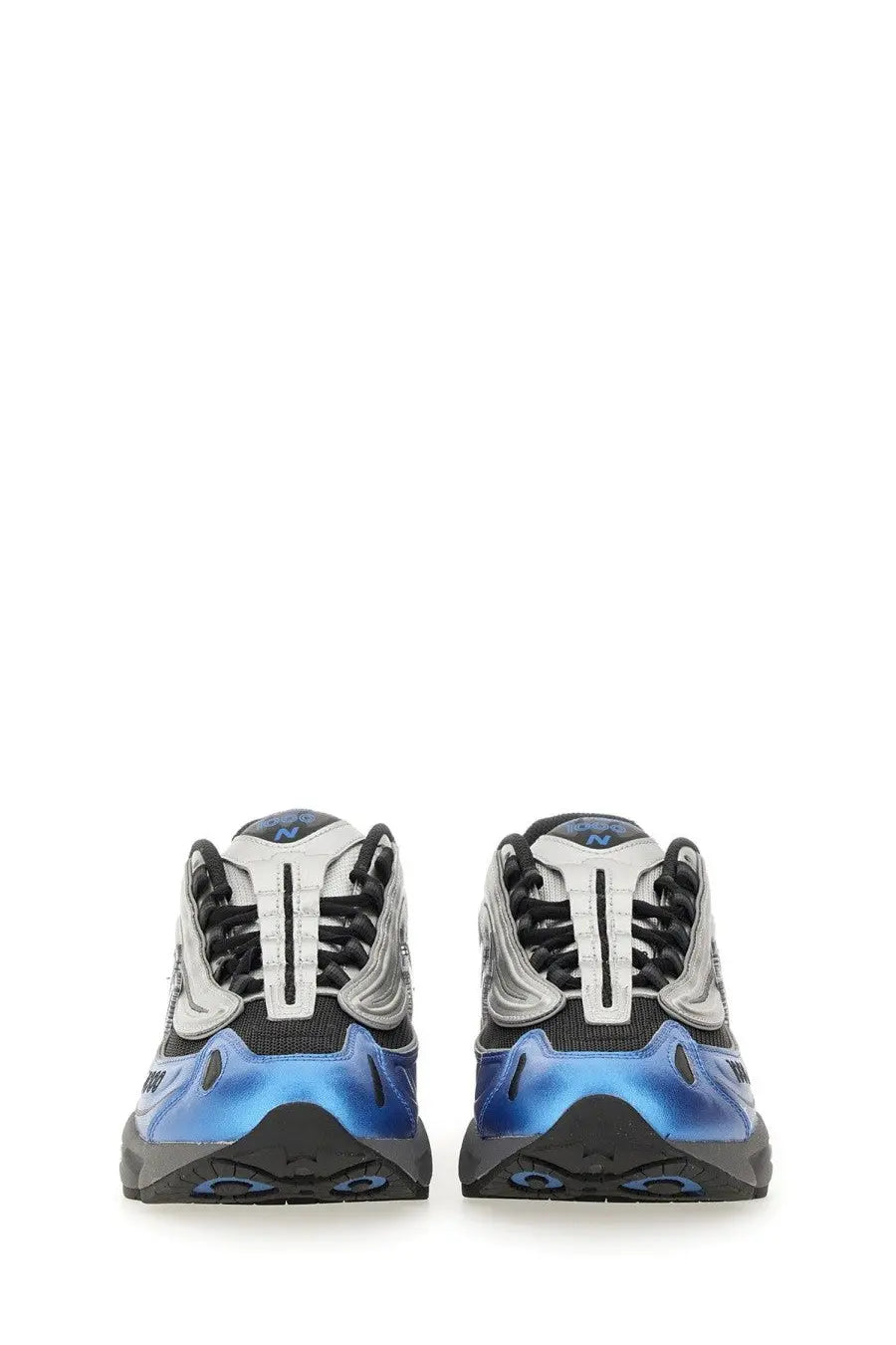 New Balance unisex sneaker blue featuring blue and silver chunky design with black laces