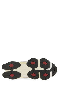 New Balance unisex sneaker grey with black and red diamond-patterned rubber sole and cream-colored midsole