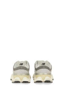 New balance unisex sneaker grey featuring gray and cream colors with a chunky layered sole design