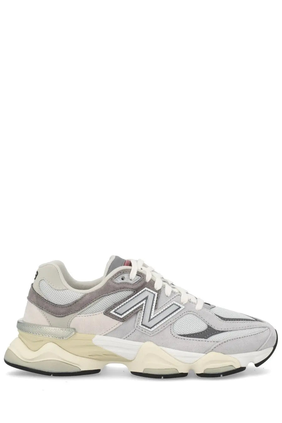 New Balance unisex sneaker grey featuring gray and cream colors with a chunky layered sole design