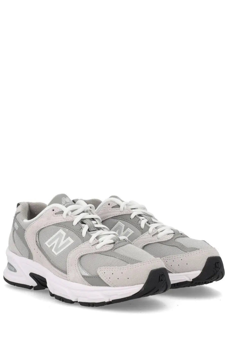 New balance unisex sneaker grey featuring gray and white mesh and suede upper with a black rubber outsole