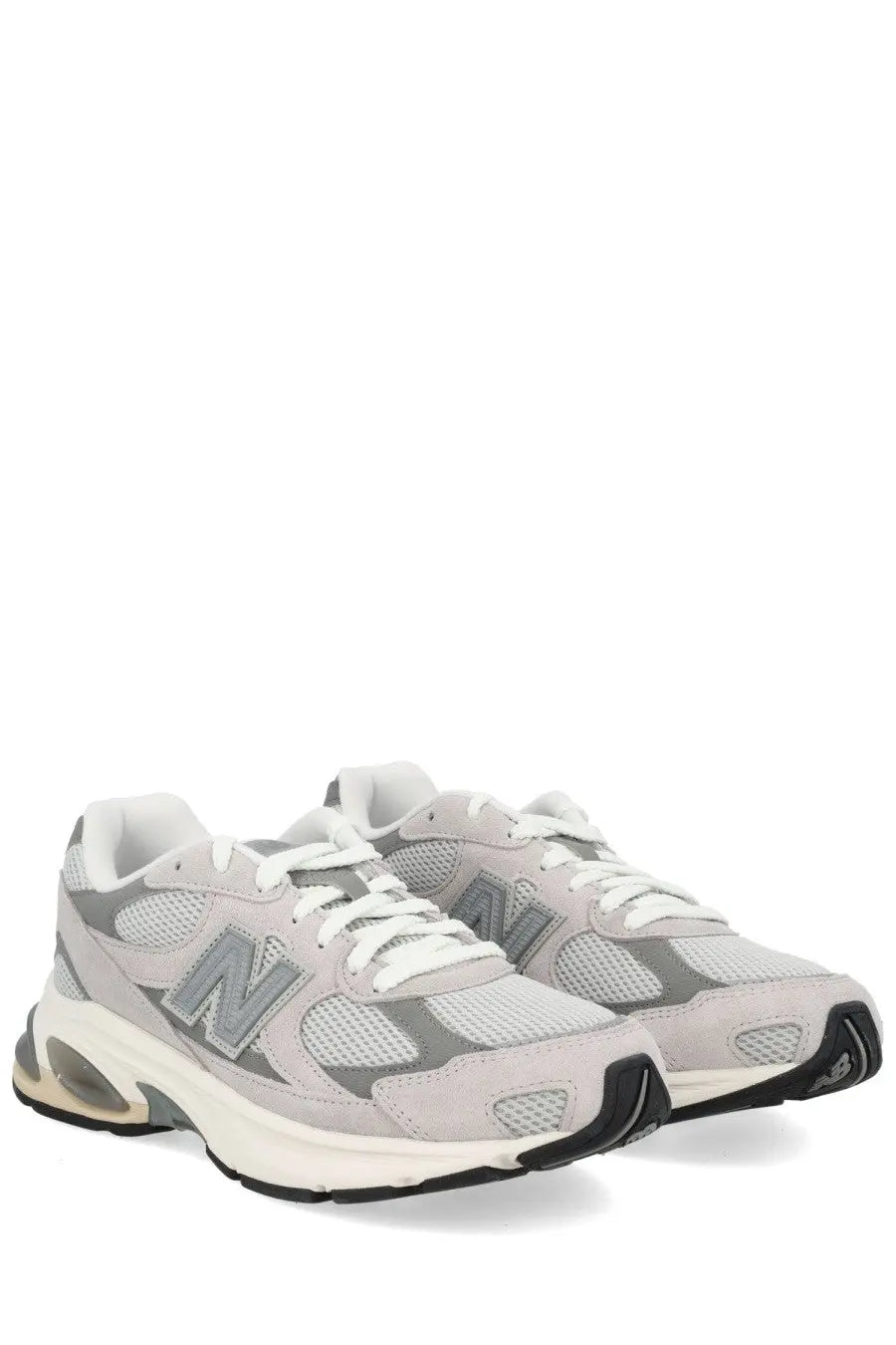 Light gray new balance 920 unisex sneaker with mesh suede upper white laces black outsole and translucent air heel unit
