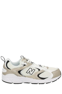 New Balance unisex sneaker multicolor beige and white 530 running shoe with black accents for sports and casual wear