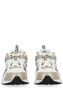 New Balance unisex sneaker in white and metallic gold with black accents and chunky sole design
