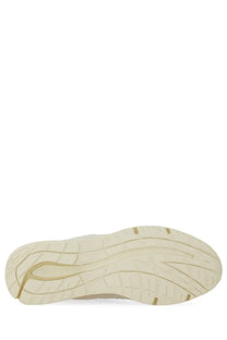 Cream-colored rubber sole with modern tread and gold accents on new balance unisex sneaker u991 white