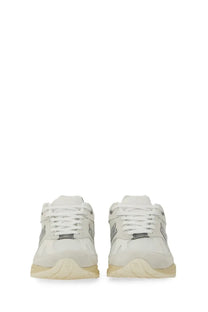 New Balance unisex sneaker U991 in white with silver accents and cream-colored sole for casual wear