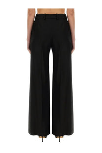 Nina Ricci women’s black wide gabardine pants with tailored fit and belt loop detail for a polished look