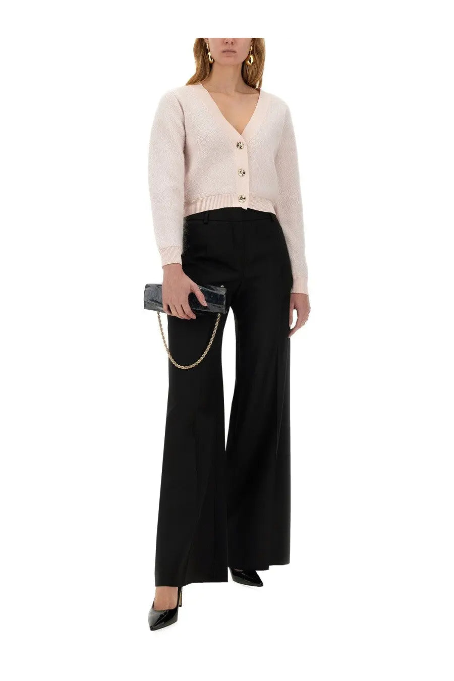 A sleek black clutch with a gold chain strap paired with nina ricci women’s wide gabardine black pants