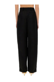 Black high-waisted wide-leg trousers by nina ricci with a sleek tailored fit perfect for formal wear