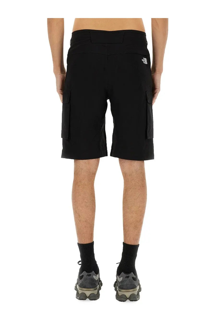 The north face men’s black cargo shorts with side pockets and branded logo on the waistband are durable and stylish