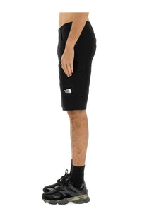 The north face men’s black cargo shorts feature a white logo on the left thigh for durable outdoor use