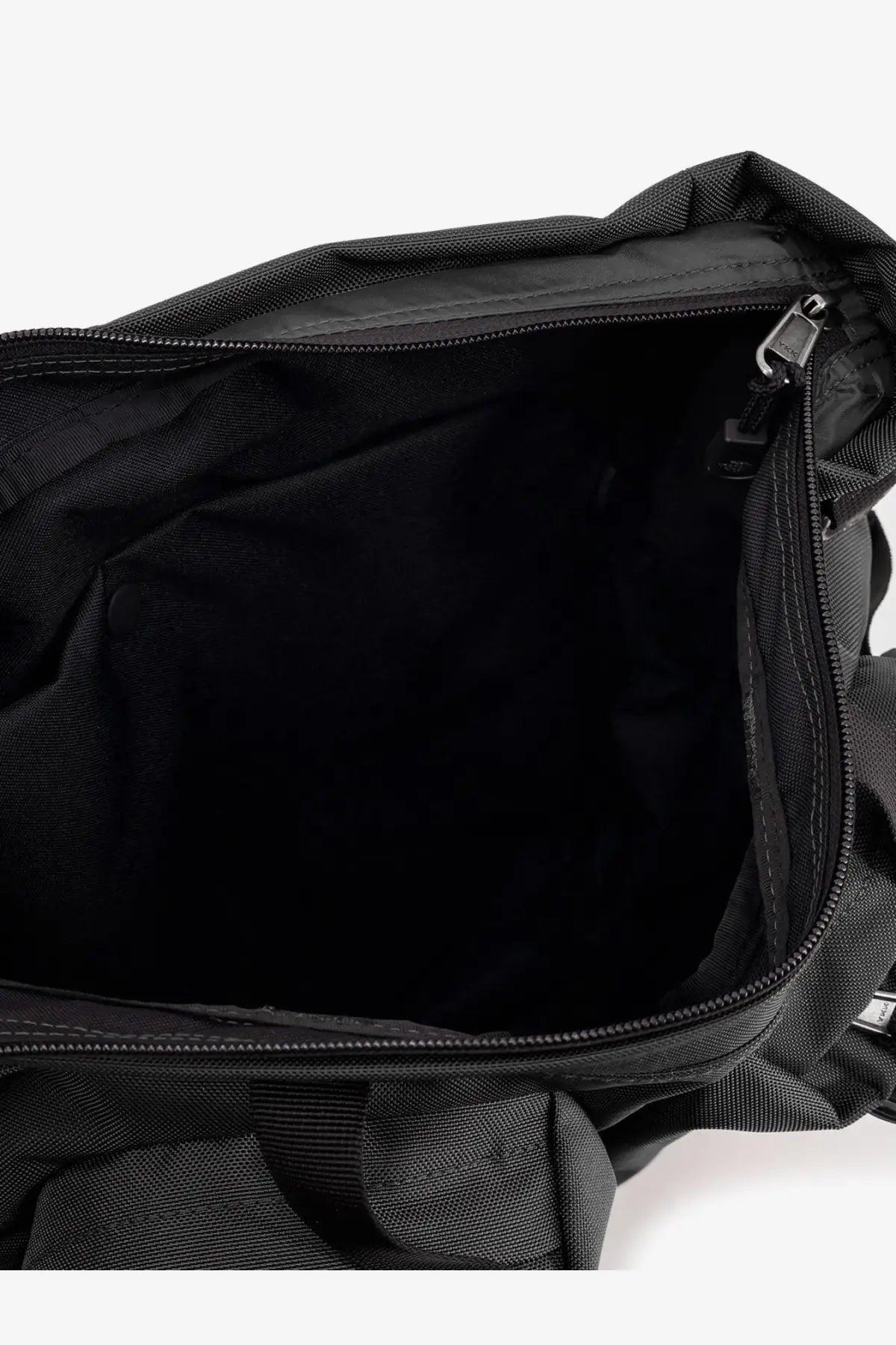 The North Face men’s black nylon duffel bag with zippered opening and reinforced stitching for durability