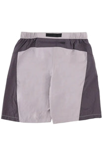 The North Face men’s gray checkered shorts with a solid light gray back panel and elastic waistband shown from the back