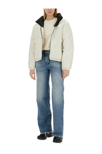 The North Face women’s down jacket in cream color features a puffer style with black-lined hood and zipper details