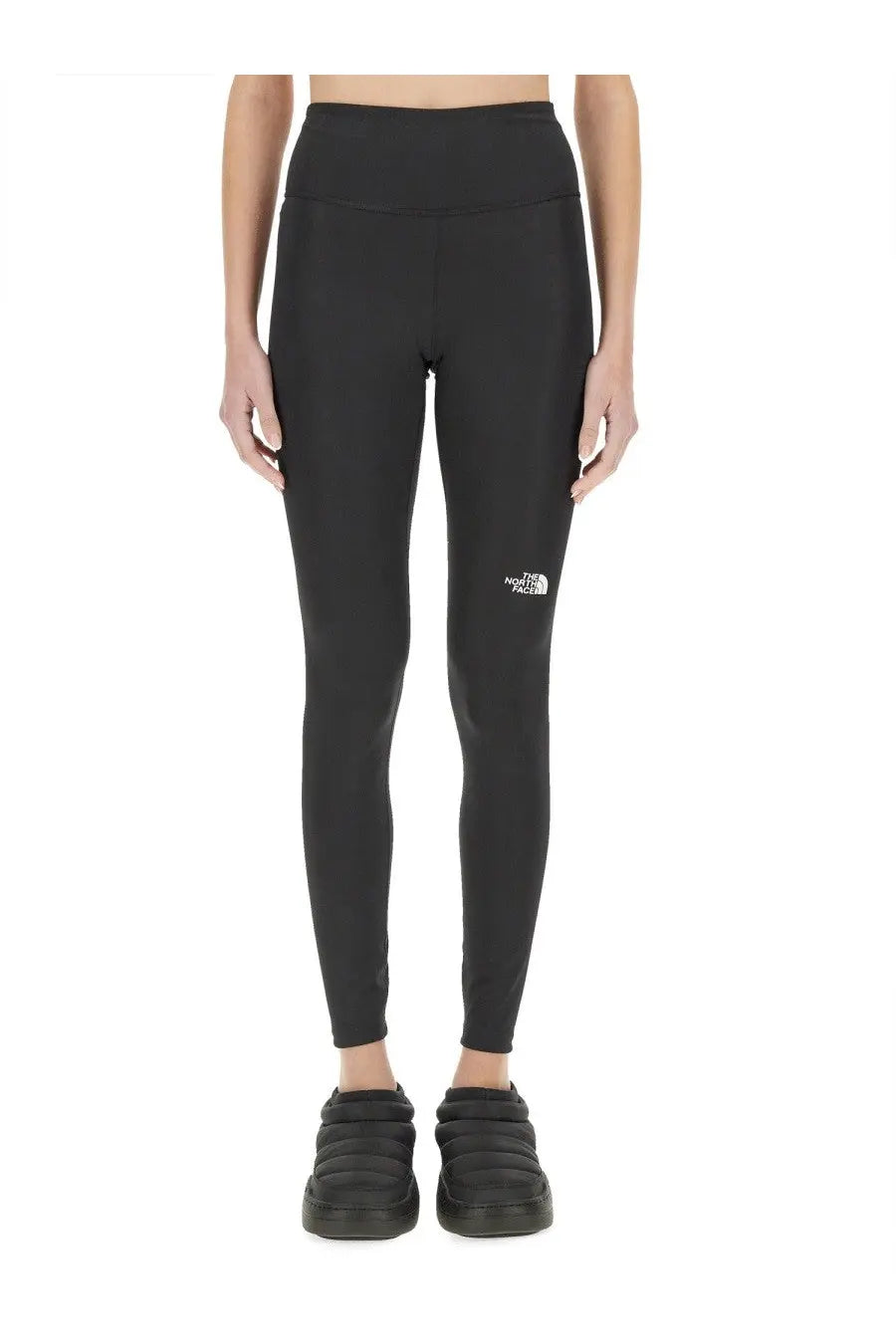 The North Face women’s black high-waisted leggings with a subtle white logo on the left thigh