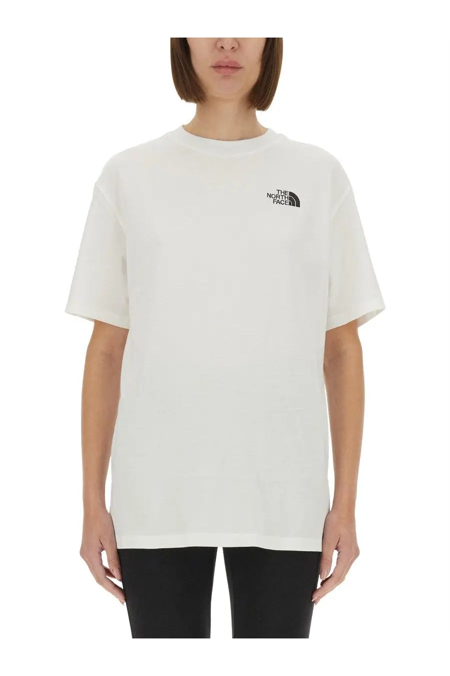 White the north face women’s oversized t-shirt with black logo on left chest for casual wear