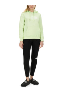 The north face women’s sweatshirt green in light green with a white logo and matching drawstrings on the chest