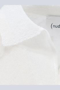 White knit polo shirt collar with soft textured cotton blend fabric and subtle ribbed detailing for women