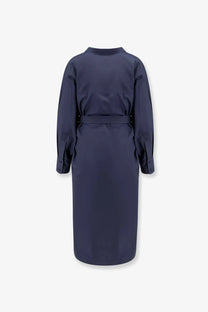 Navy blue cotton trench coat with belted waist and long sleeves for women shown from the back