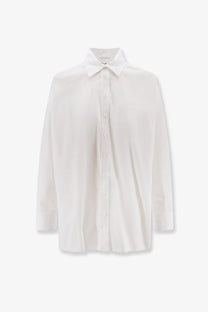 Nude women’s white cotton shirt with a minimalist design, crisp collar, and lightweight long sleeves