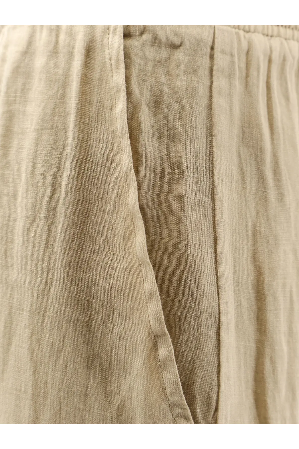 Nude women’s linen blend trousers in beige with a relaxed fit and visible seam detailing