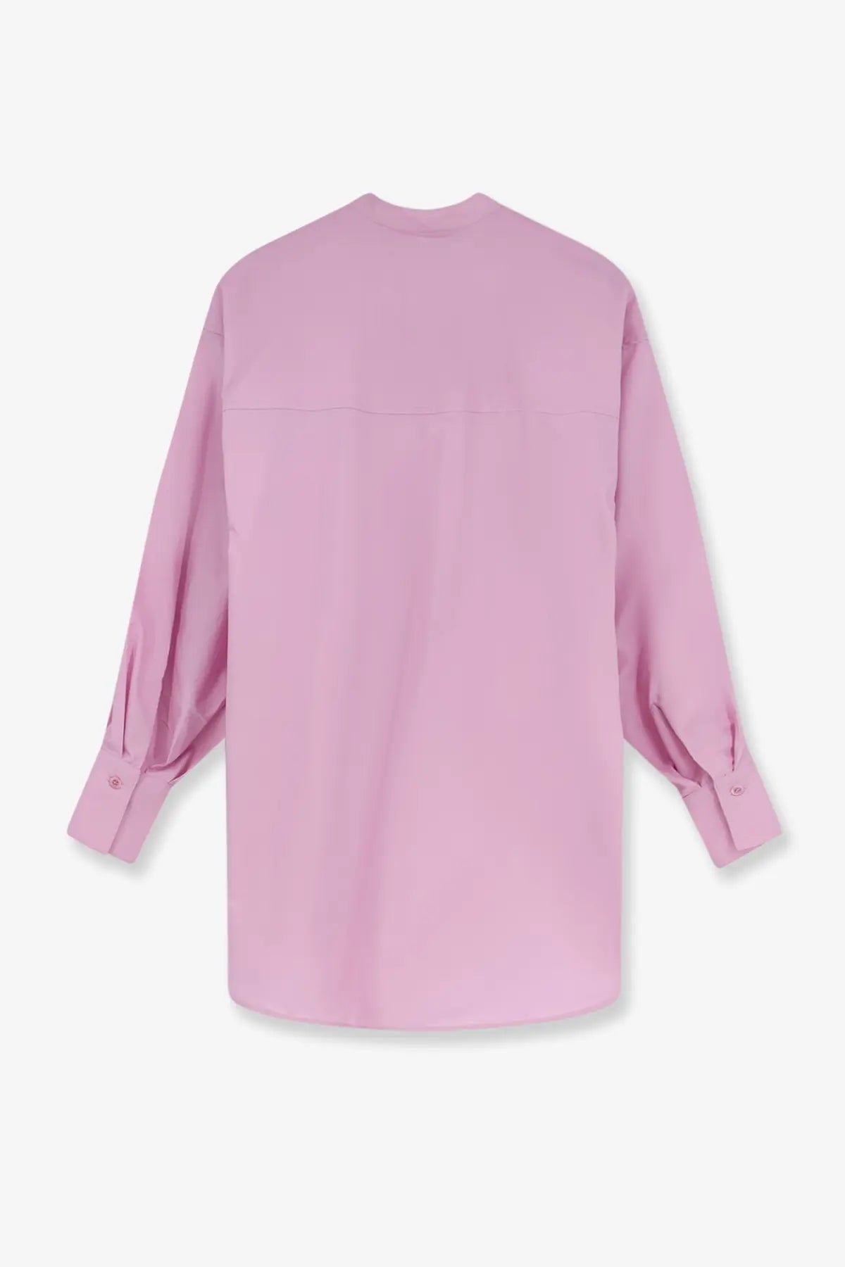 A soft pink oversized cotton button-up shirt for women with long sleeves and relaxed fit