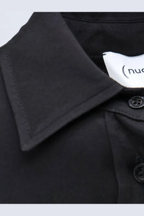 Black collared viscose shirt for women with subtle texture and matching black buttons from nude collection