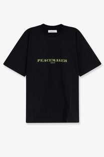 Oamc peacemaker men’s black cotton t-shirt with light green peacemaker print in sans serif font across the chest