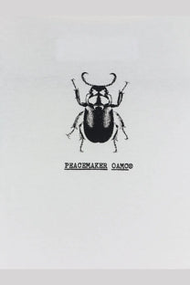 Oamc peacemaker men’s white cotton shirt with black ink rhinoceros beetle illustration on fabric front
