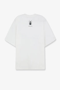 White oversized cotton oamc peacemaker men’s t-shirt showing the back with a black printed beetle graphic
