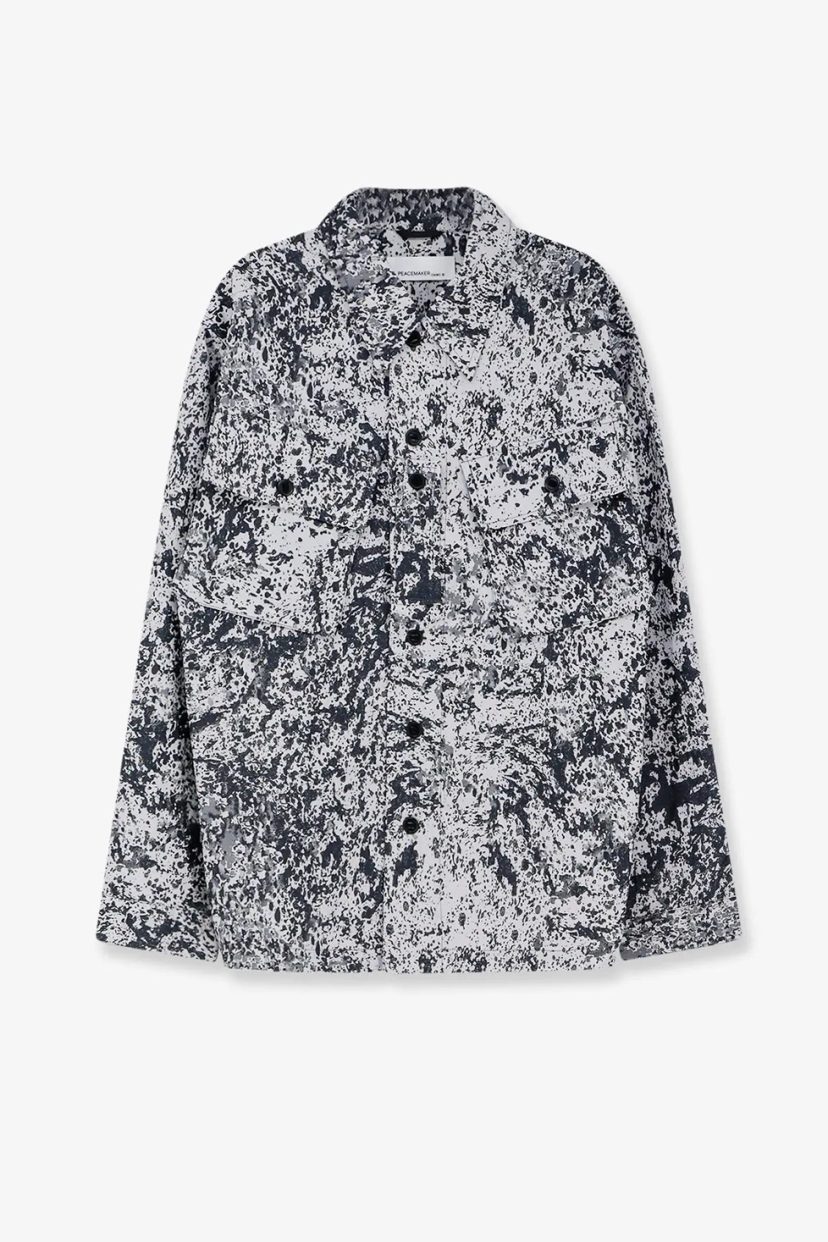 Oamc Peacemaker men’s military cargo shirt in black and white splatter pattern with relaxed fit and button-up design