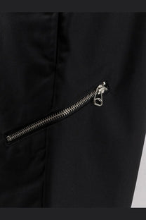 Black nylon jacket with silver zipper and pull tab paired with oamc peacemaker men’s regs wool blend trousers black