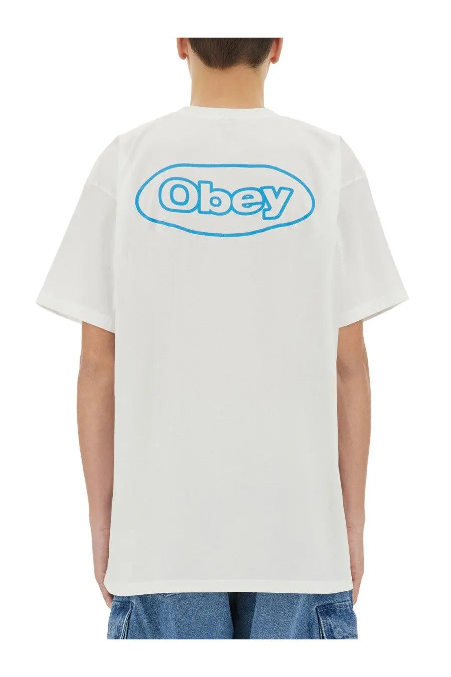 Back view of obey men’s reaction white t-shirt with light blue oval logo printed on cotton fabric