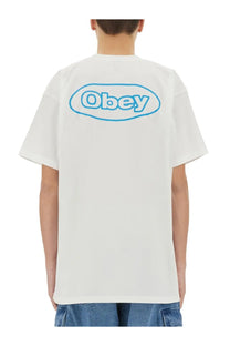 Back view of obey men’s reaction white t-shirt with light blue oval logo printed on cotton fabric