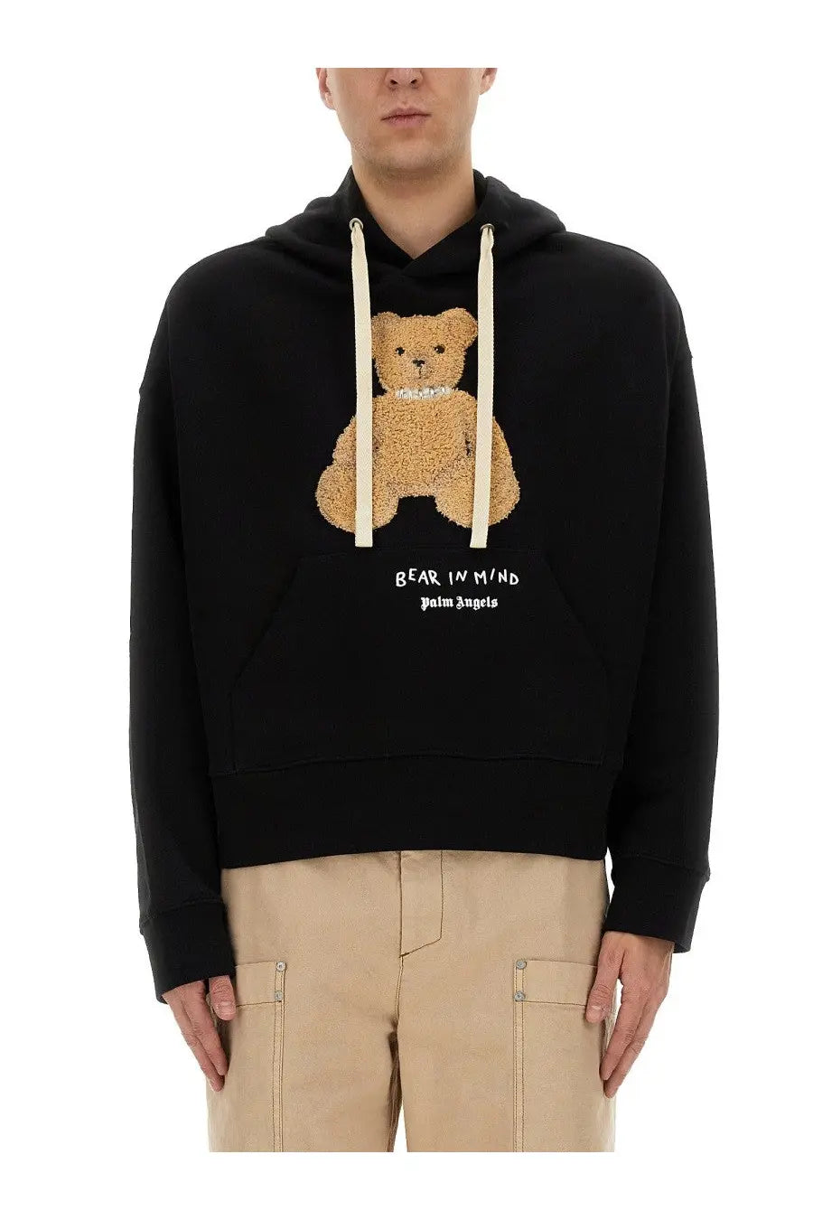 Palm Angels men’s black hoodie with tan teddy bear appliqué wearing a pearl necklace and embroidered text on front