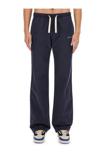 Palm Angels men’s dark navy blue drawstring sweatpants with white cord and subtle embroidered branding on the thigh