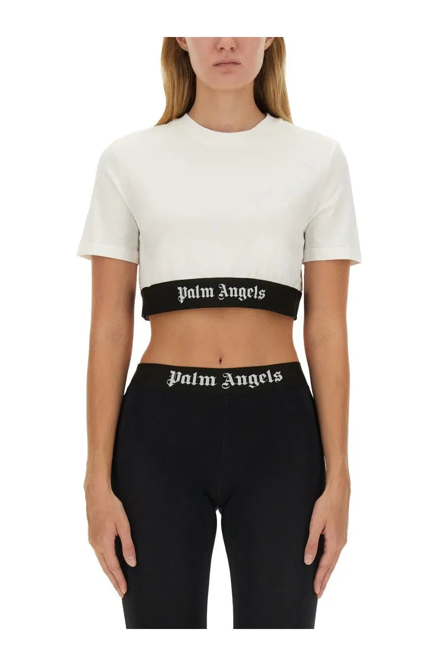 White cropped t-shirt with black band and palm angels logo in white lettering across the waistline for women