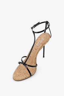 Black patent leather strappy high heel sandal with cork insole and slender stiletto heel by paris texas