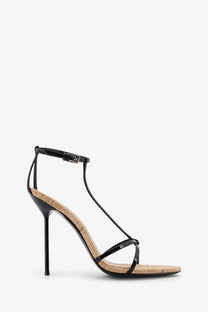 Black patent leather strappy high heel sandal with cork insole and slender stiletto heel by paris texas